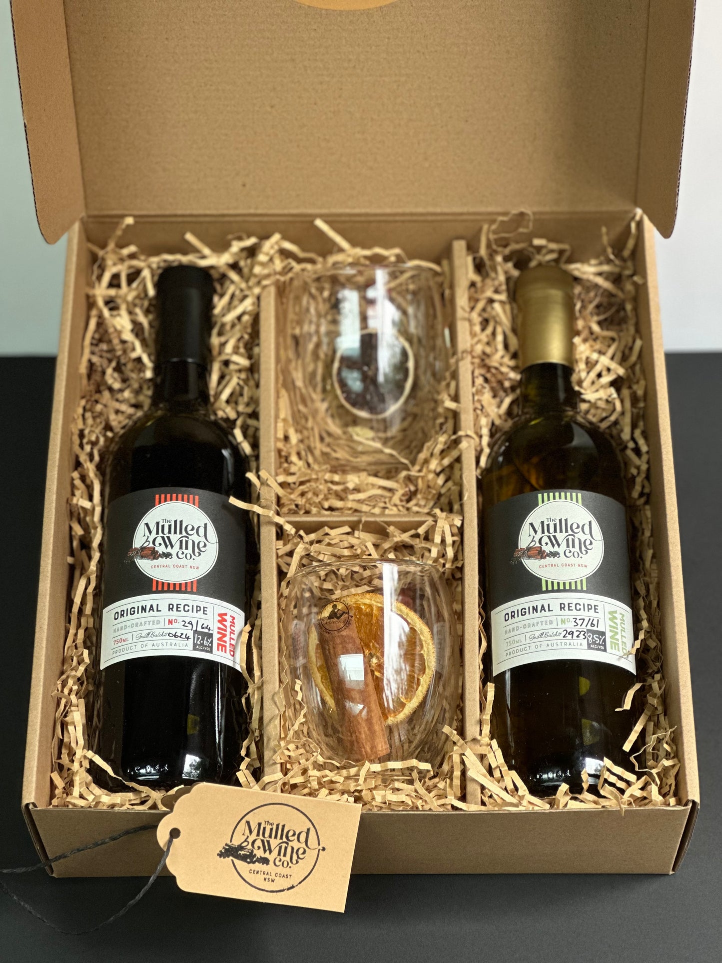 Corporate gift hamper with two bottles and two glasses.